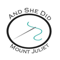 And She Did Logo